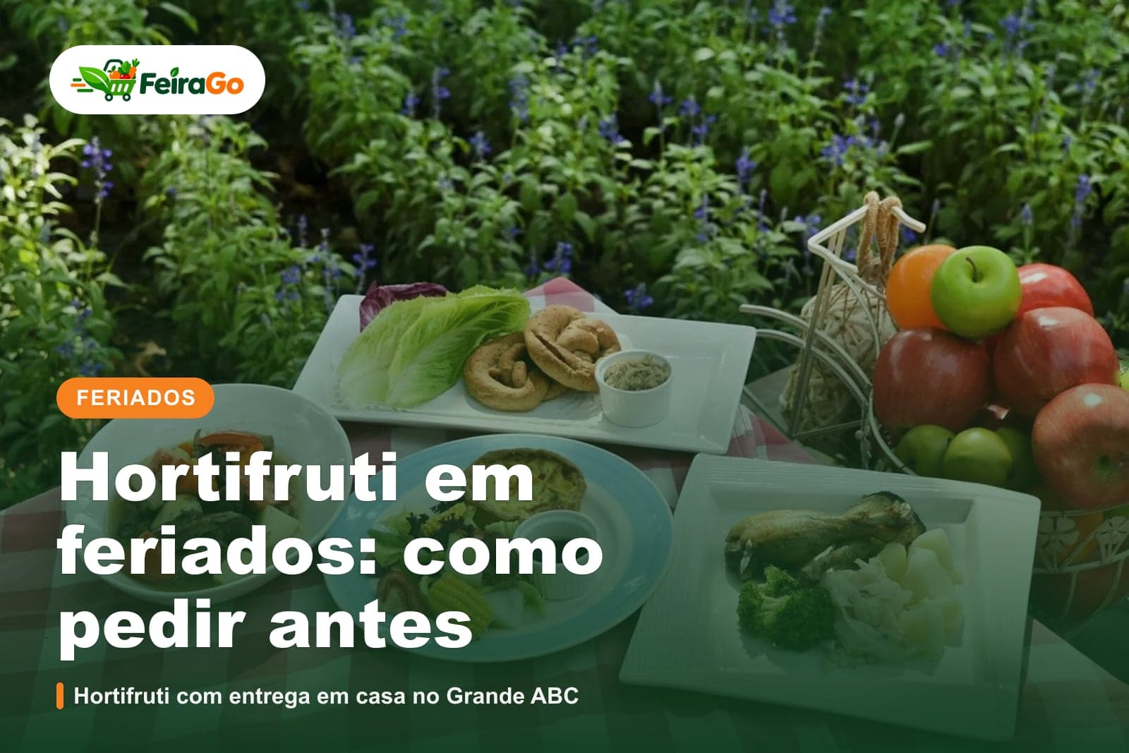 Mesa de piquenique ao ar livre com pratos de comida e uma cesta de maçãs